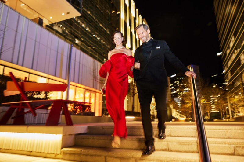 A couple walking at night in Dallas Arts District
